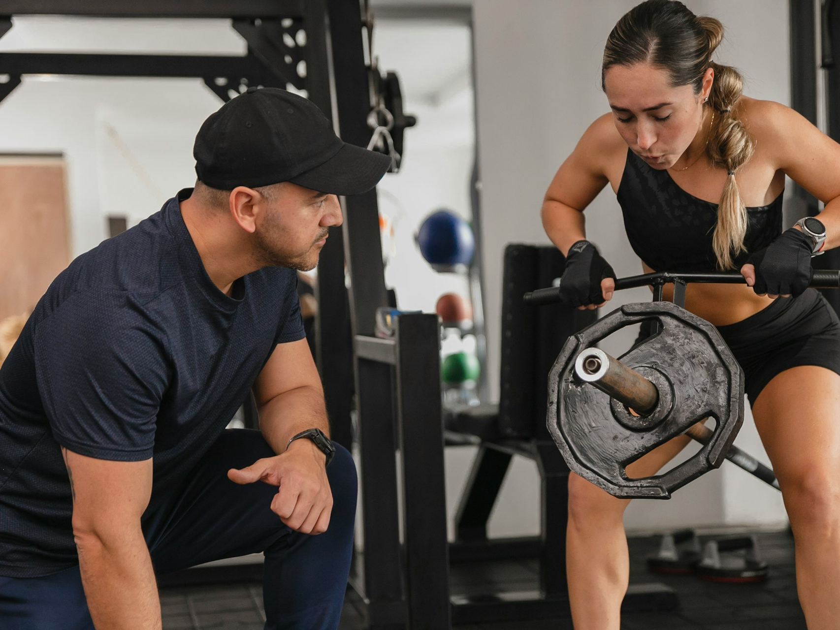 ness trainer in a training session with a client