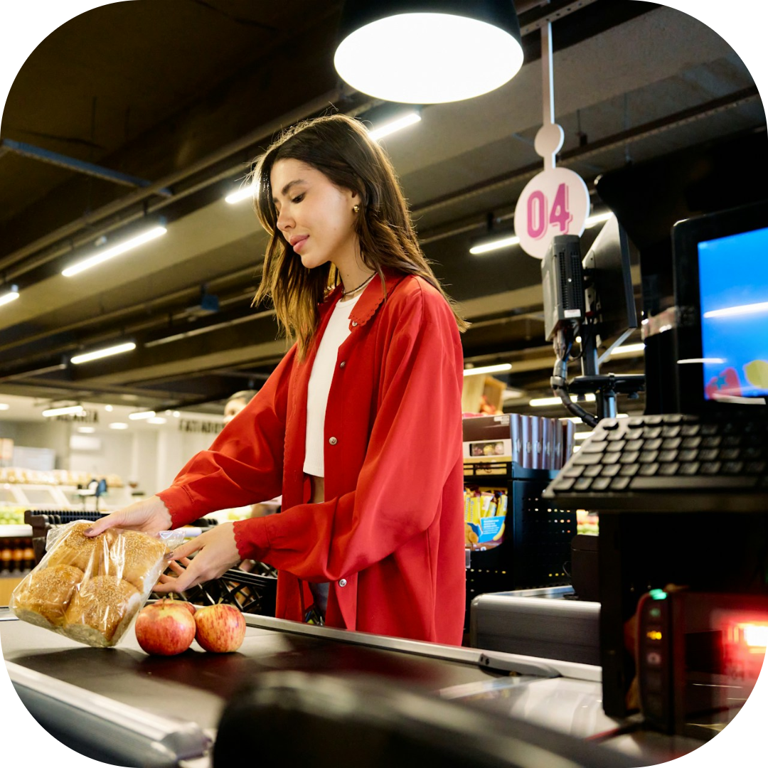 lady at the checkout with groceries