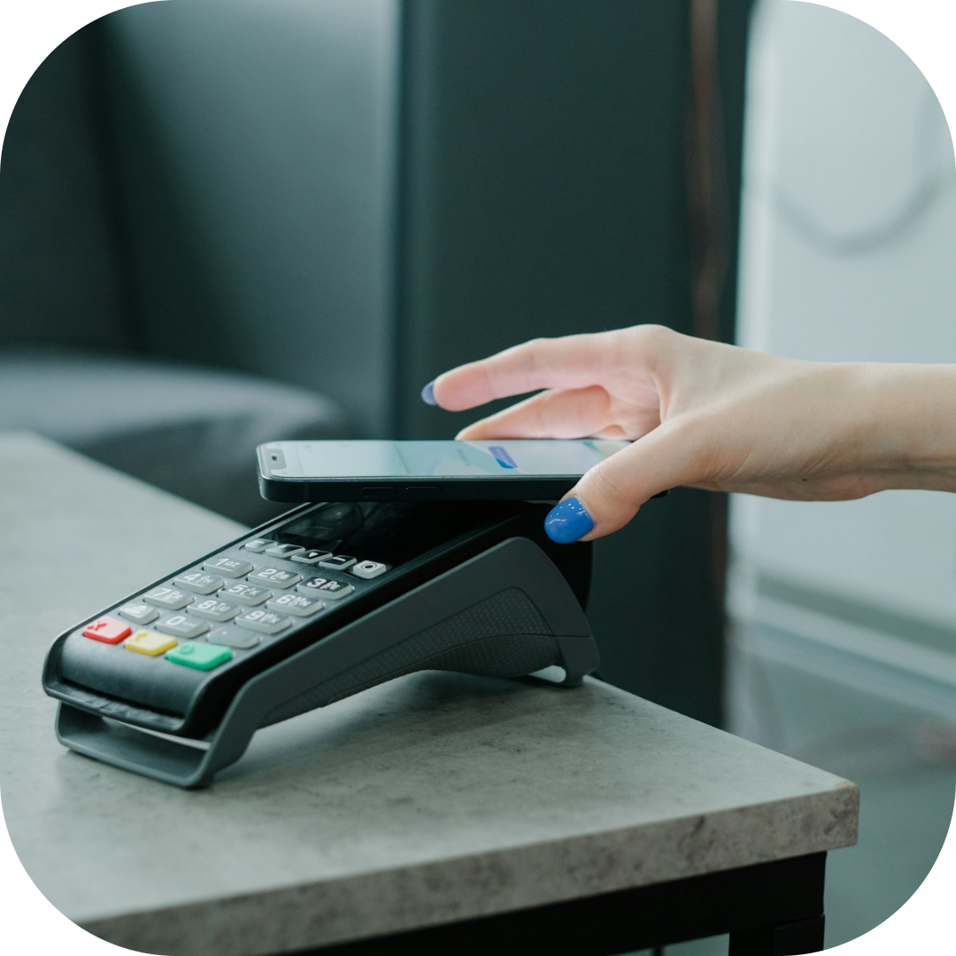 guest using mobile phone to pay bill