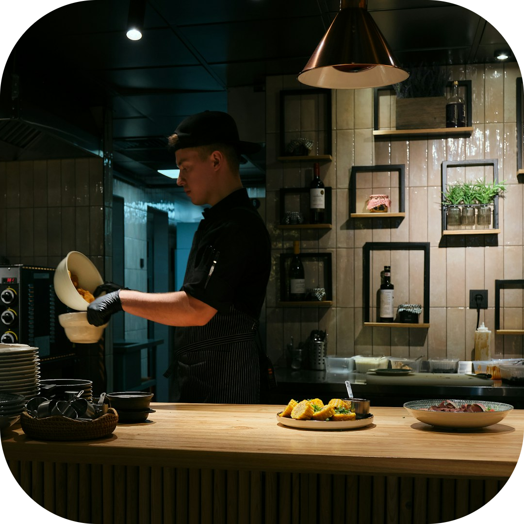 chef making meals for customers in the kitchen