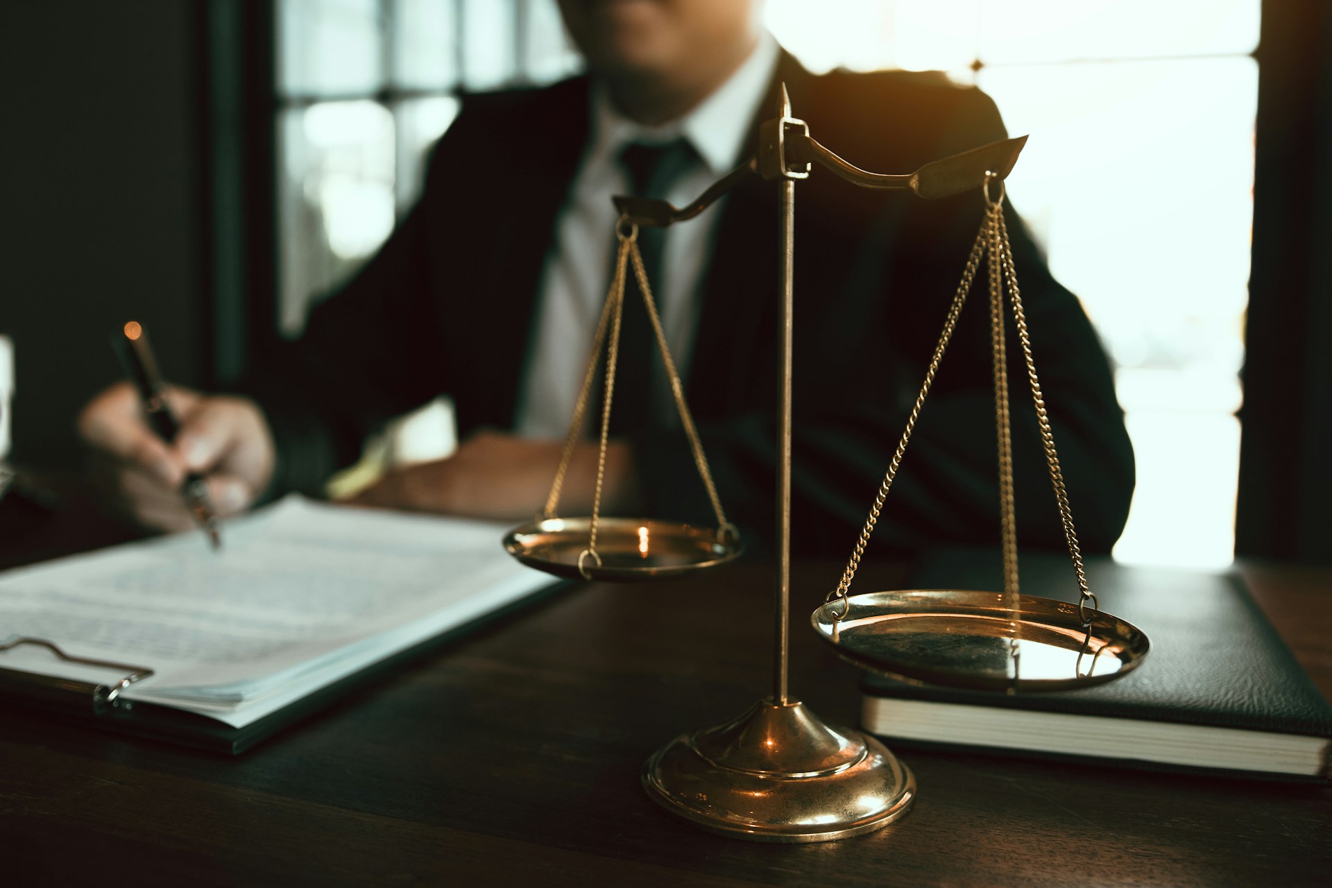 lawyer signing and reading documents