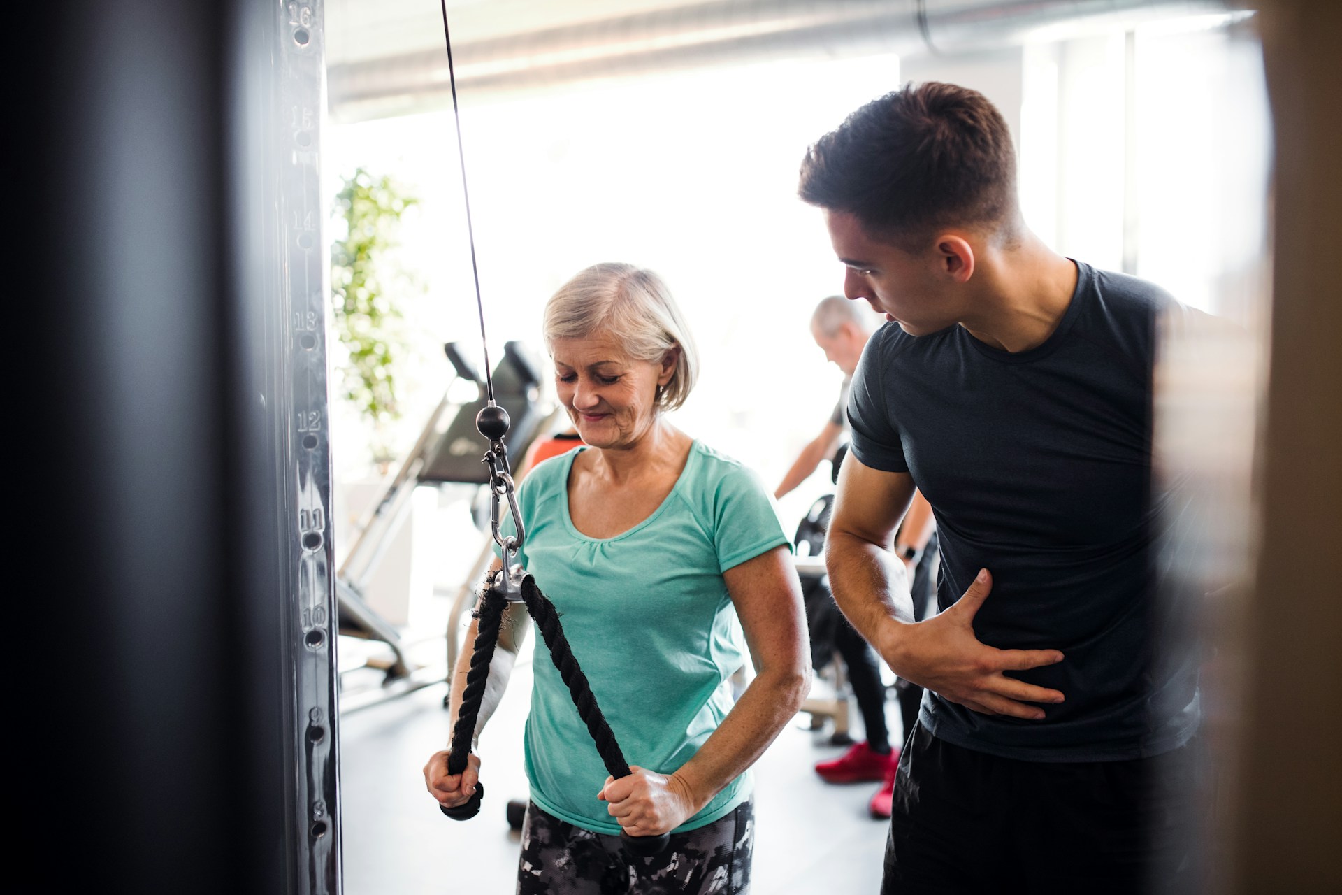 trainer with client working out