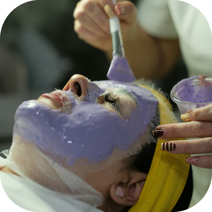 client getting a facial at the spa