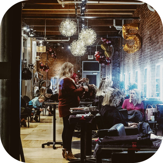 a packed hair salon with customers