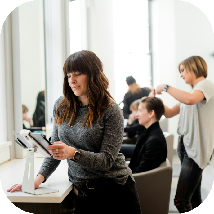 hair salon owner working on her tablet