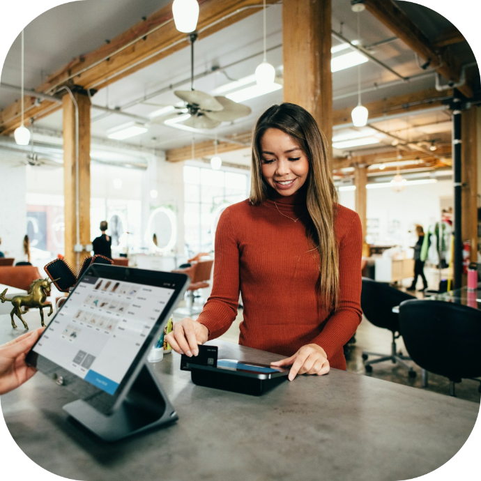 customer paying for her services at the front desk