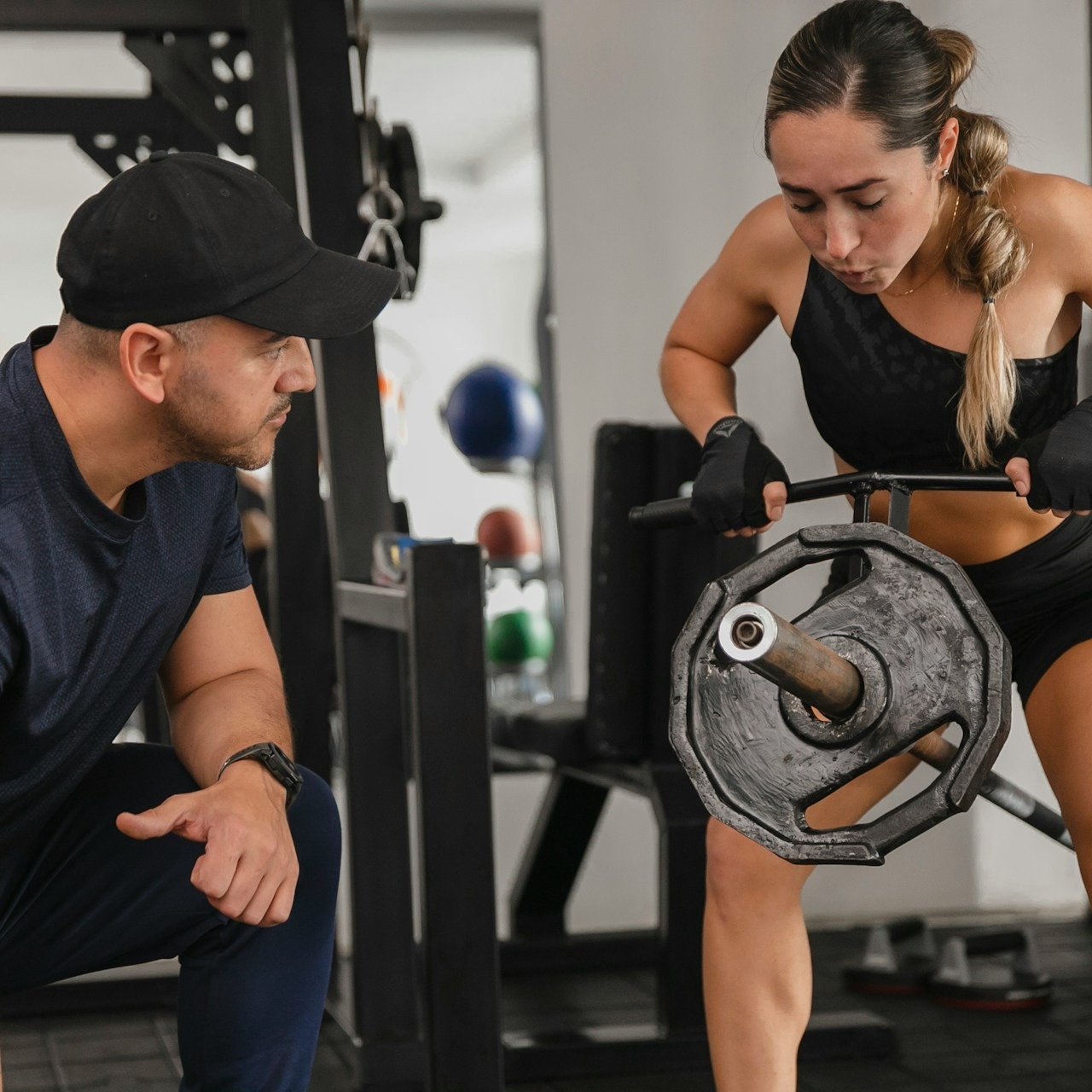 ness trainer in a training session with a client